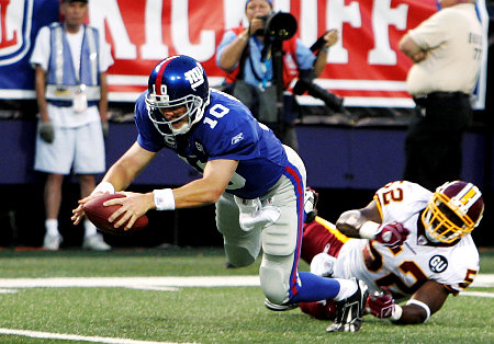 Eli running the ball for a rare rushing TD after juking out a Redskin LB 
